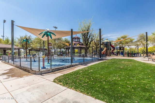 view of sport court featuring playground community, a lawn, and fence