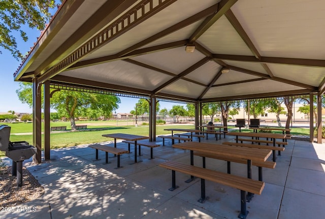 surrounding community with a gazebo, a lawn, and a patio area