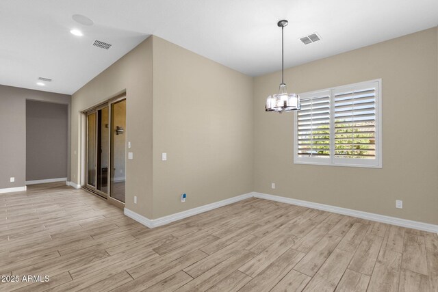 10350 E Texas Ave, Mesa, AZ 85212 - spare room featuring light wood-type flooring, baseboards, and a chandelier