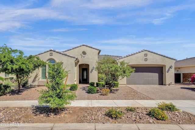10350 E Texas Ave, Mesa, AZ 85212 - mediterranean / spanish house featuring decorative driveway, a garage, and stucco siding