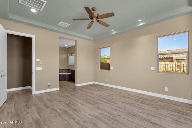 10350 E Texas Ave, Mesa, AZ 85212 - unfurnished bedroom featuring light wood-style flooring, baseboards, ensuite bathroom, recessed lighting, and a ceiling fan