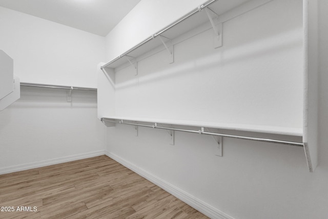 10350 E Texas Ave, Mesa, AZ 85212 - walk in closet featuring light wood-style flooring