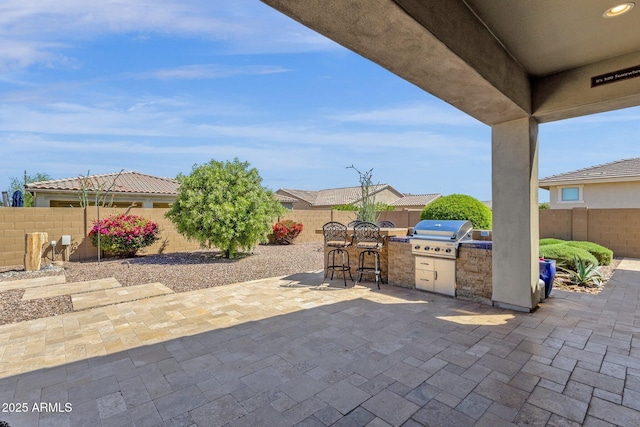 10350 E Texas Ave, Mesa, AZ 85212 - view of patio featuring area for grilling, a grill, a fenced backyard, and a bar