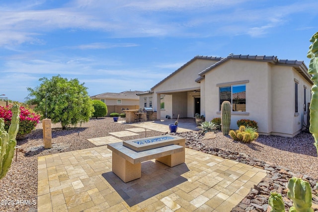 10350 E Texas Ave, Mesa, AZ 85212 - view of patio featuring a fire pit