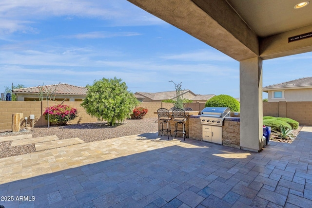 10350 E Texas Ave, Mesa, AZ 85212 - view of patio / terrace with exterior kitchen, area for grilling, a fenced backyard, and a bar