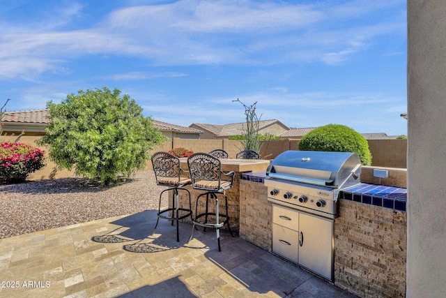 10350 E Texas Ave, Mesa, AZ 85212 - view of patio / terrace with grilling area, exterior kitchen, and a fenced backyard