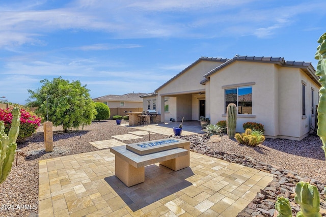 10350 E Texas Ave, Mesa, AZ 85212 - view of patio / terrace featuring a fire pit