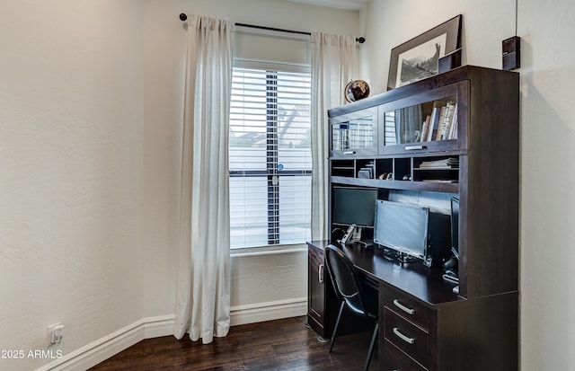 office area with baseboards and dark wood-type flooring