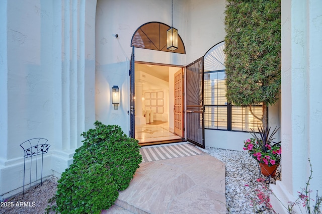 property entrance featuring stucco siding