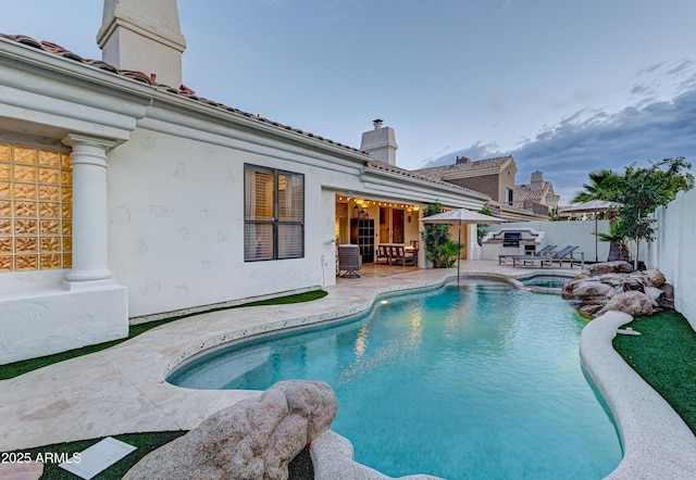 view of pool featuring a patio, fence, a pool with connected hot tub, and central air condition unit