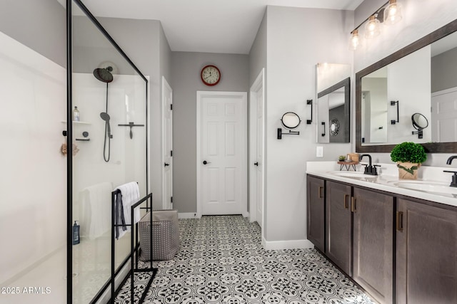 bathroom with vanity and a shower with door