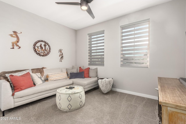 carpeted living room featuring ceiling fan