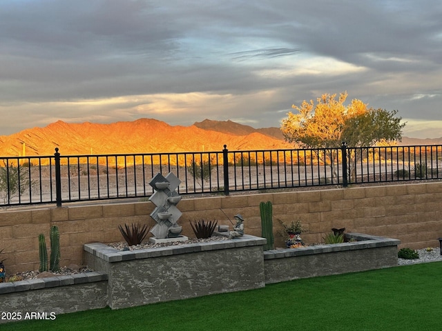 yard at dusk with a mountain view