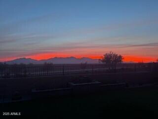 yard at dusk with a mountain view