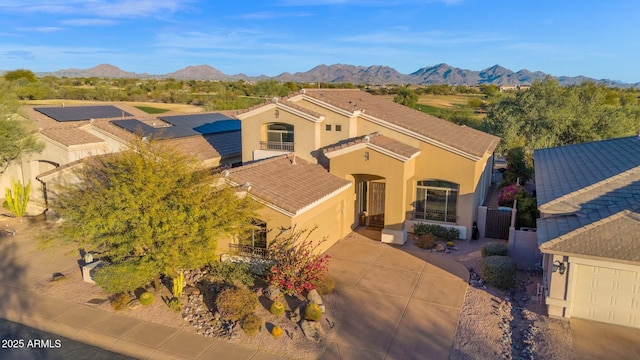 view of front of home featuring a mountain view