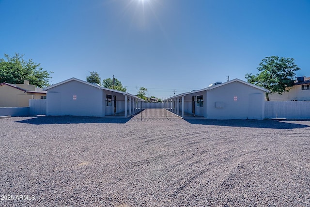 rear view of property with fence