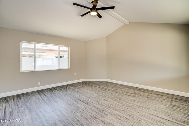 empty room with a ceiling fan, wood finished floors, and baseboards