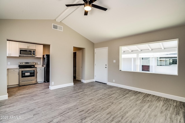 unfurnished living room with beam ceiling, light wood-style flooring, ceiling fan, baseboards, and high vaulted ceiling