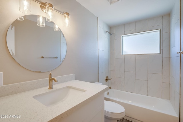 full bath with toilet, vanity, and shower / bath combination