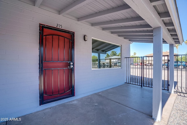 entrance to property with concrete block siding
