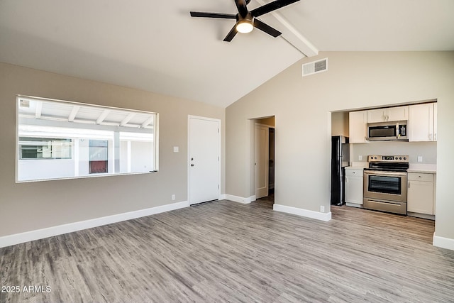 unfurnished living room featuring light wood-style flooring, beam ceiling, ceiling fan, baseboards, and high vaulted ceiling