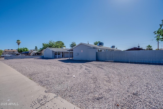 view of front of property with fence and central air condition unit