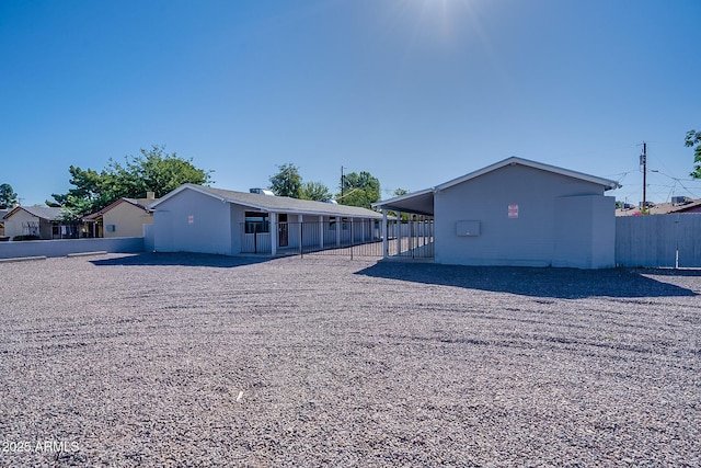 rear view of house with fence
