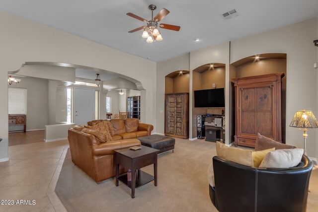 living room featuring ceiling fan and light tile patterned floors