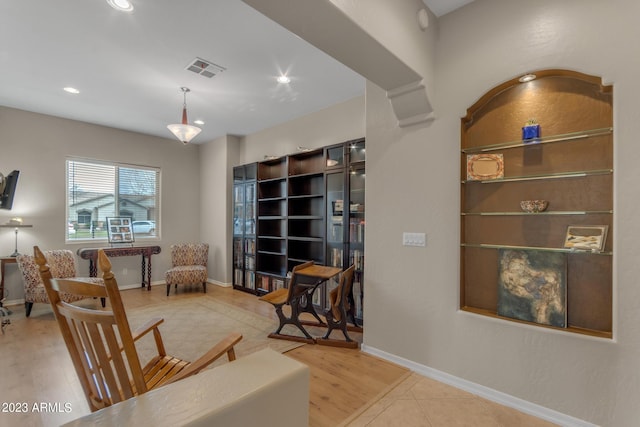 sitting room featuring hardwood / wood-style flooring