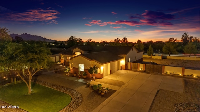 view of front facade with a mountain view and a patio area