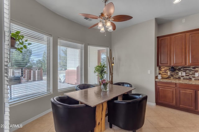 dining room featuring light tile patterned flooring and ceiling fan