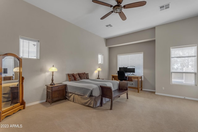 bedroom with ceiling fan and light colored carpet