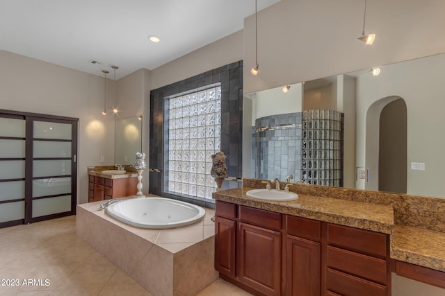 bathroom with vanity, separate shower and tub, and tile patterned floors