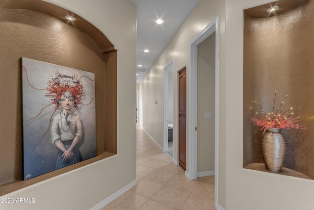 hall with light tile patterned flooring