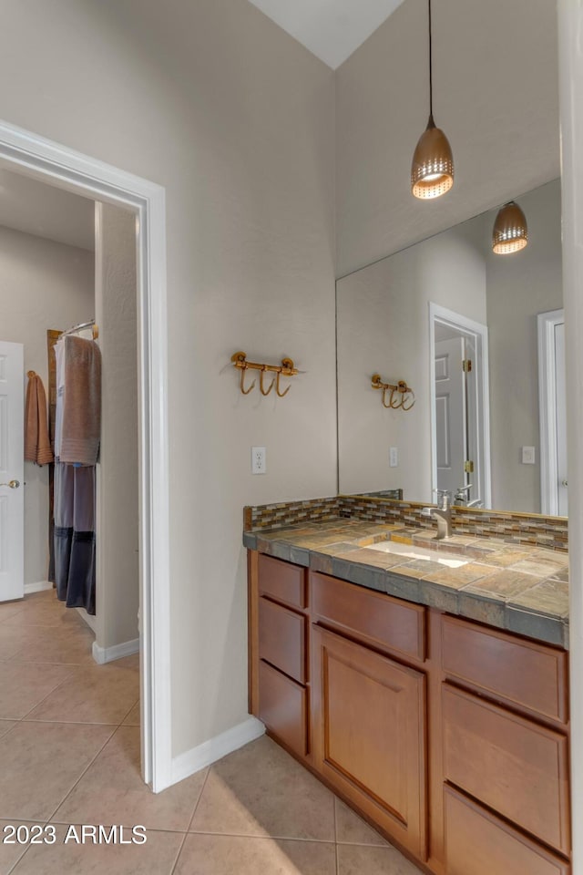 bathroom with vanity and tile patterned flooring