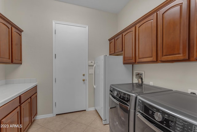 interior space featuring independent washer and dryer, light tile patterned floors, and white refrigerator