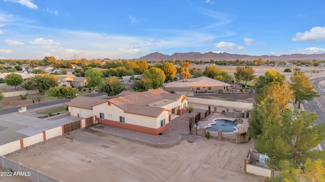 birds eye view of property with a mountain view