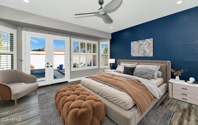 bedroom featuring dark wood-type flooring, ceiling fan, french doors, and access to exterior