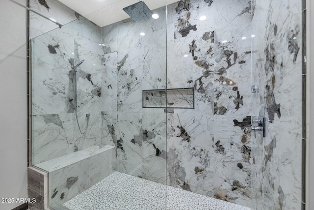 bathroom with a tile shower