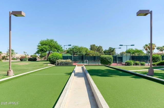 view of property's community with tennis court