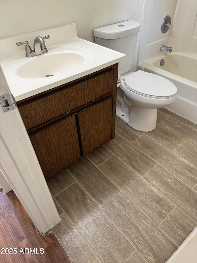 full bathroom featuring toilet, shower / bath combination, and vanity