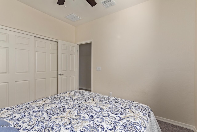 bedroom featuring ceiling fan, carpet, and a closet