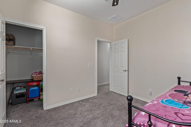 carpeted bedroom with a closet and ceiling fan