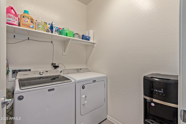 washroom featuring washing machine and clothes dryer