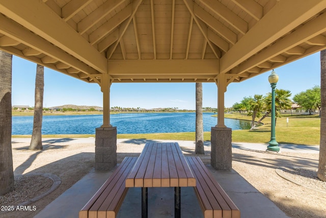 view of patio / terrace with a gazebo and a water view