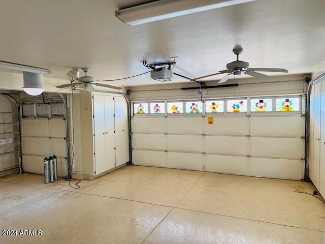 garage with ceiling fan and a garage door opener