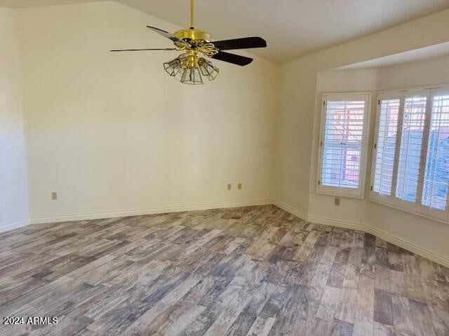 unfurnished room featuring light hardwood / wood-style flooring, ceiling fan, and lofted ceiling