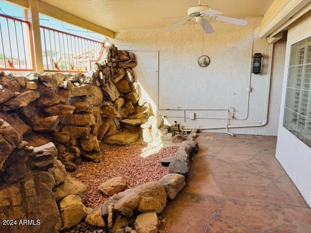 exterior details featuring ceiling fan