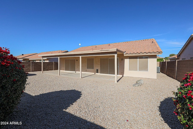 back of house featuring central AC unit and a patio area