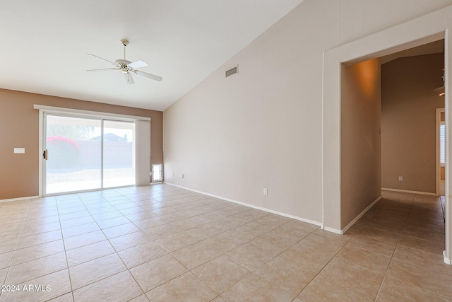 tiled spare room featuring ceiling fan and high vaulted ceiling